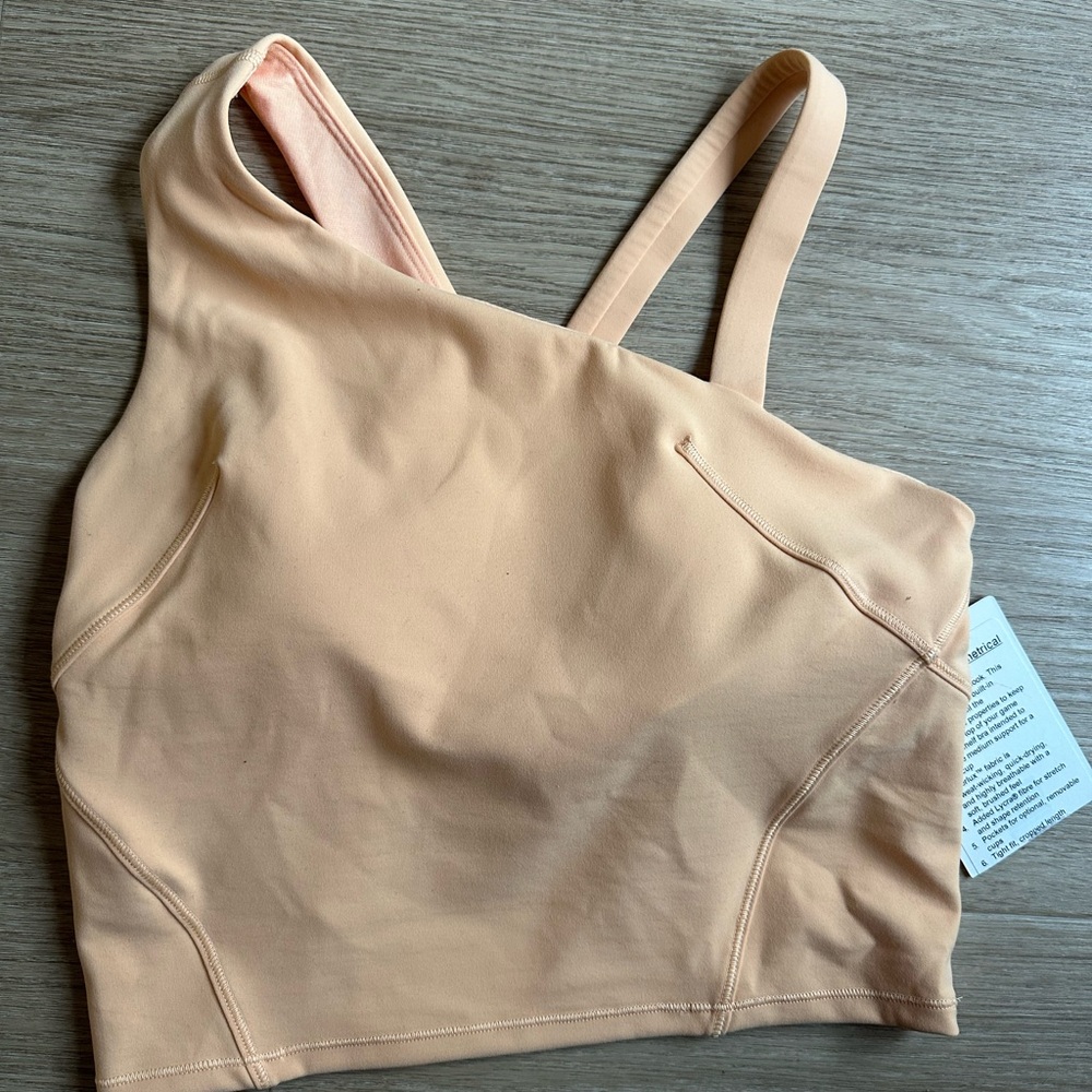 Everlux Asymmetrical Tennis Tank Top
Medium Support, B/C Cup  Peach color size:4